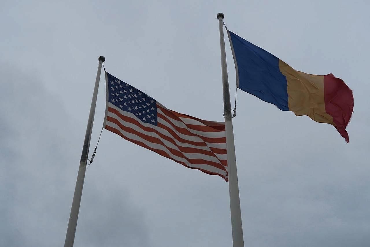 us-and-romanian-flags
